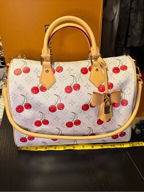 Fabulous soft sided satchel with cherries and denim monogram interior